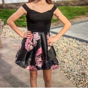 Beautiful off the shoulder dress. Black with pink roses flowers.